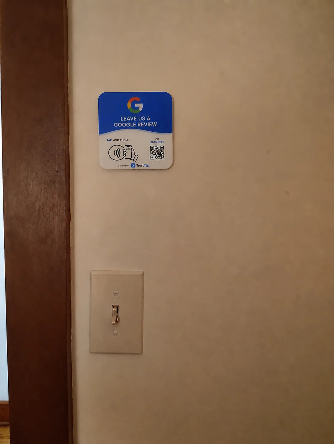 English TrustTap plate on a visible wall